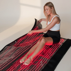 Infrared Therapy Blanket - Heal & Recover with red light wavelengths for muscle relief and circulation, shown in use by a woman at home.