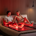 Infrared Therapy Blanket - Heal & Recover used by couple on bed, emitting red light to enhance muscle recovery and boost circulation at home.